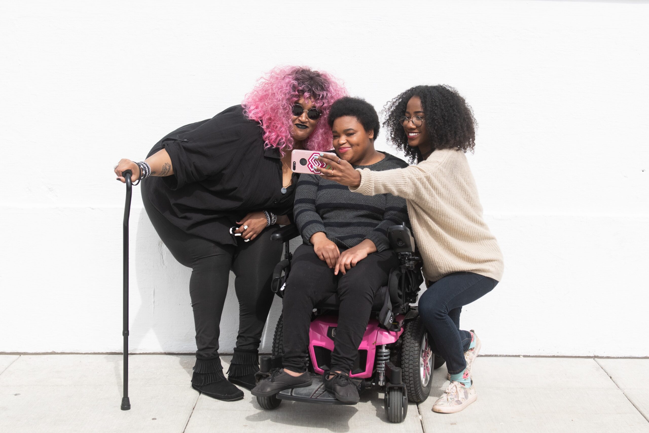 BIPOC with disability taking a selfie.